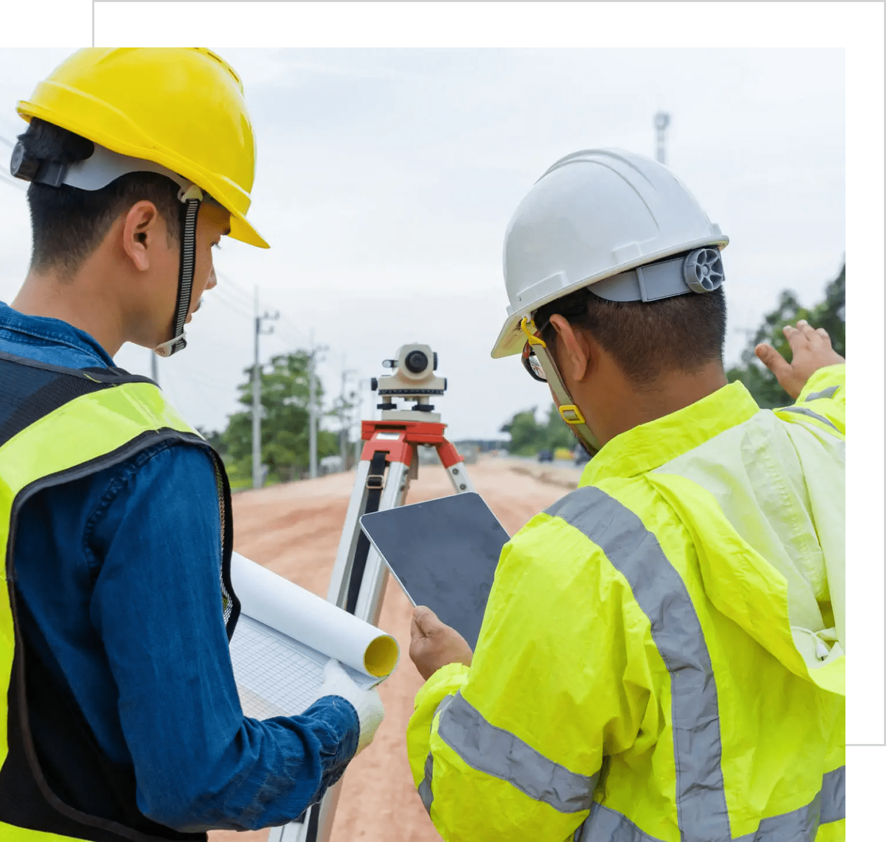 Construction workers reviewing plans outdoors