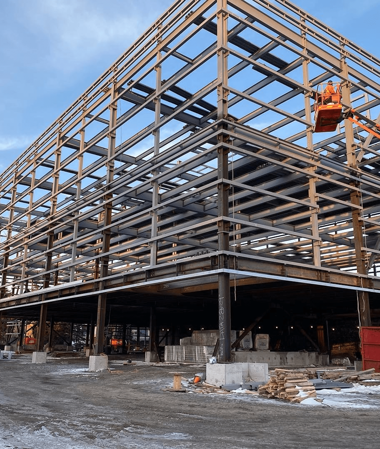 Building under construction with metal framework.