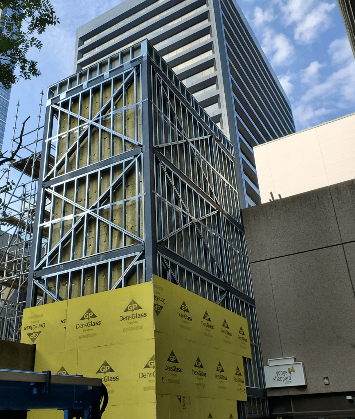 Building under construction with metal framework.
