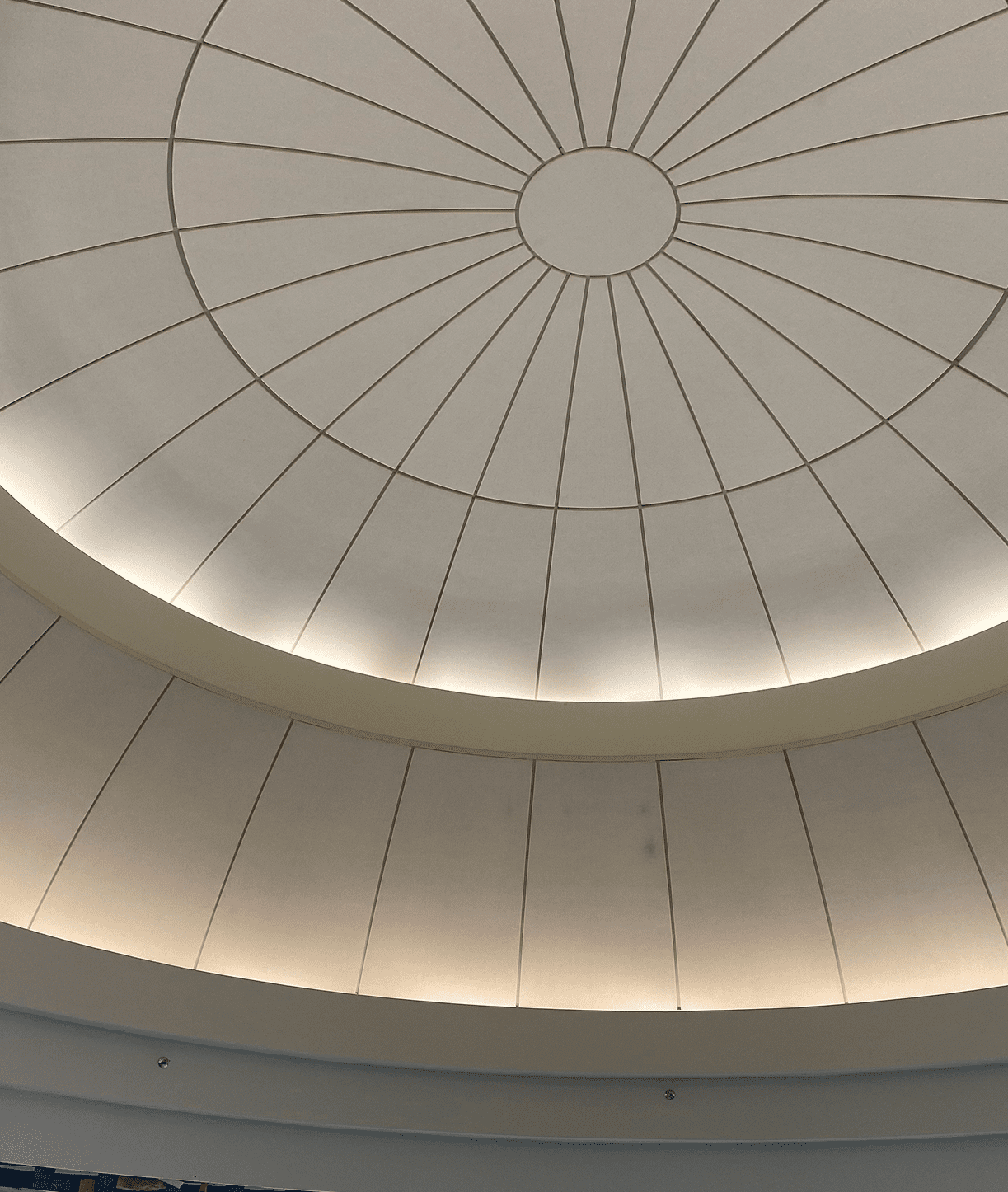 Circular ceiling with geometric pattern design.