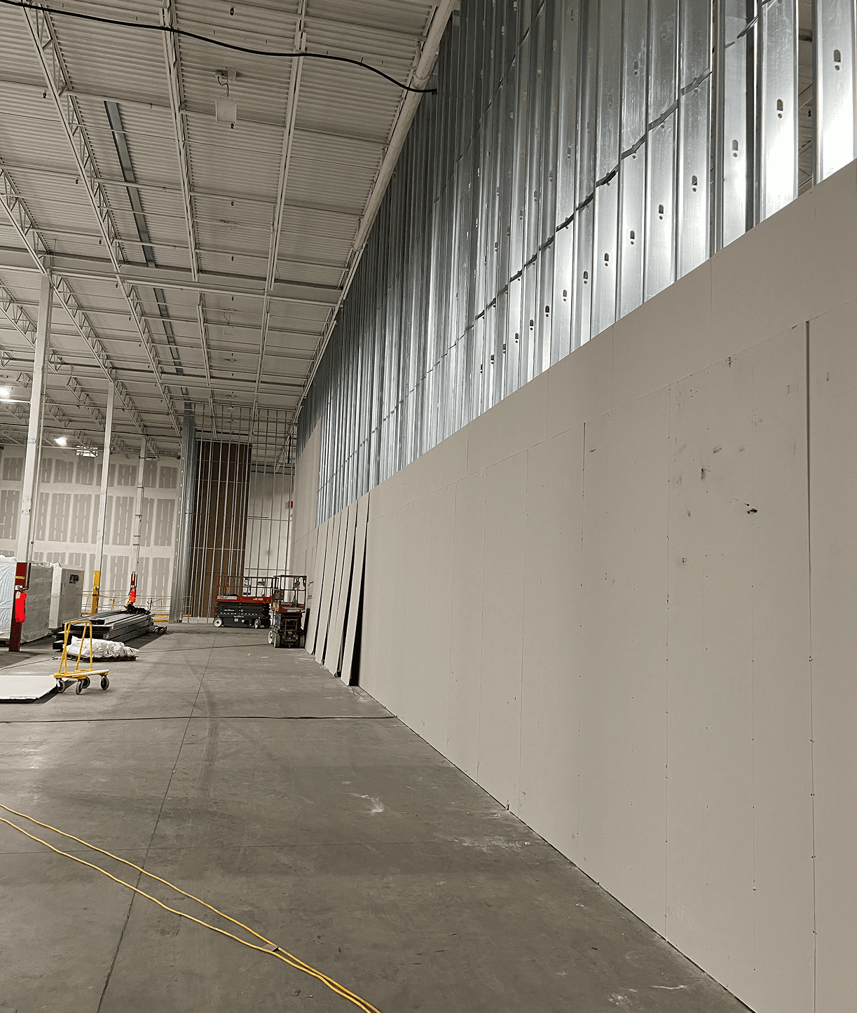 Warehouse under construction with metal framework.