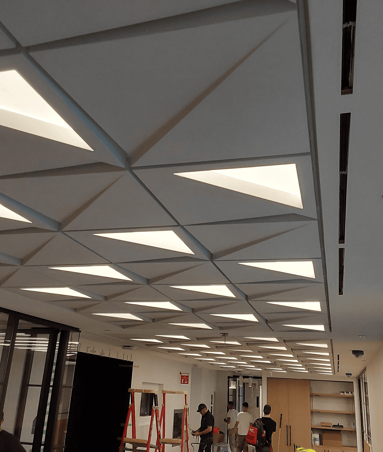 Geometric ceiling lights in modern office space
