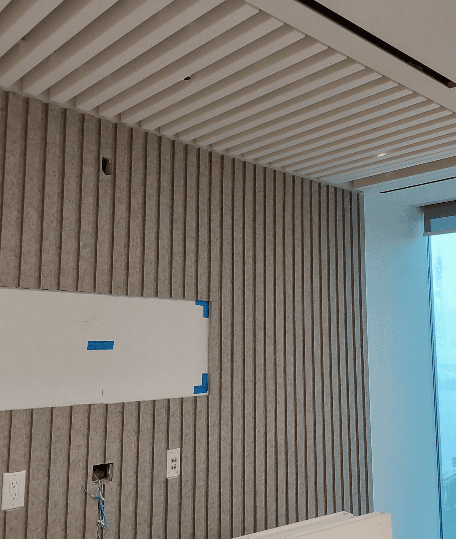Interior wall with vertical acoustic panels