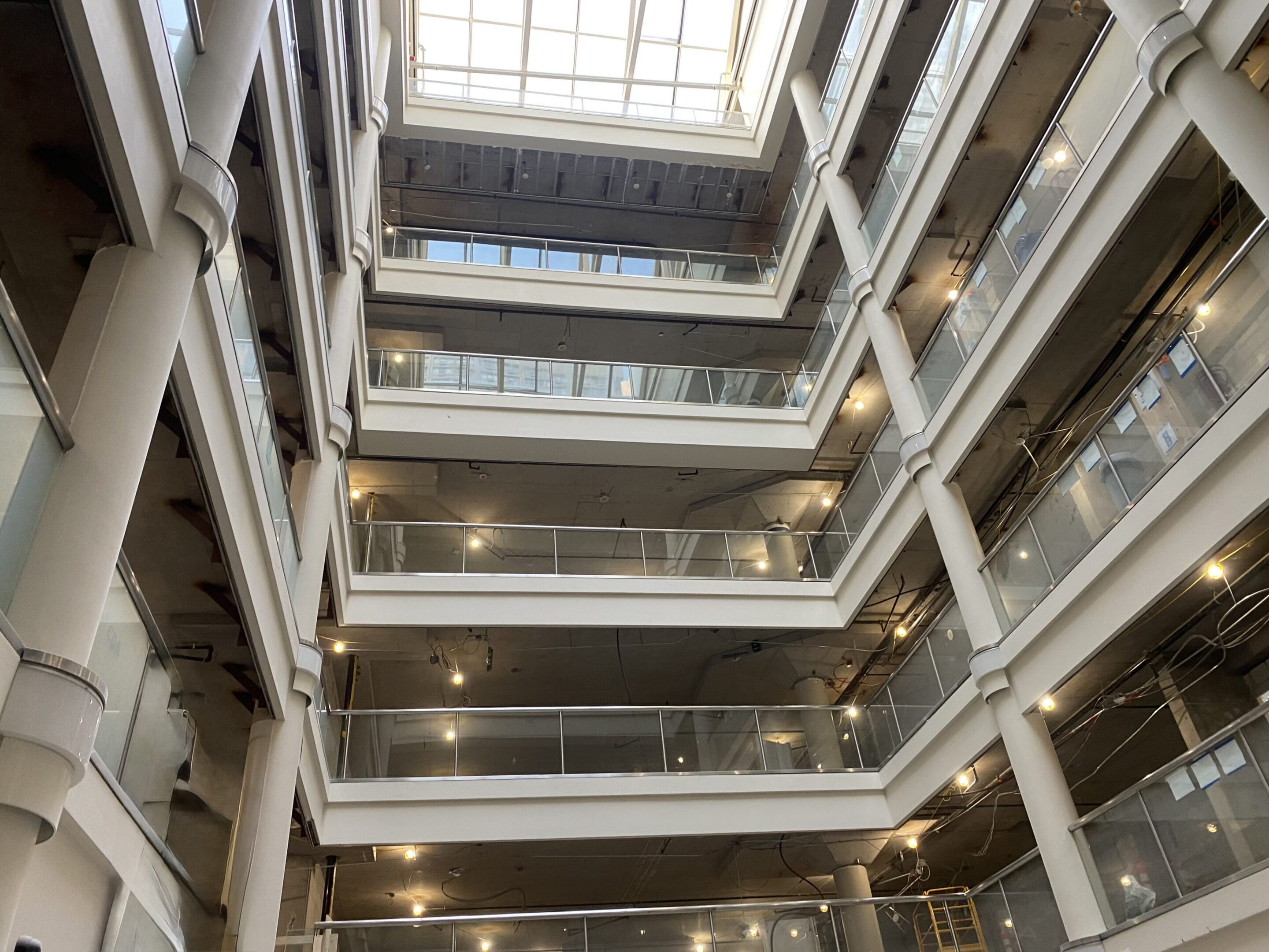 Modern multi-story atrium with skylight