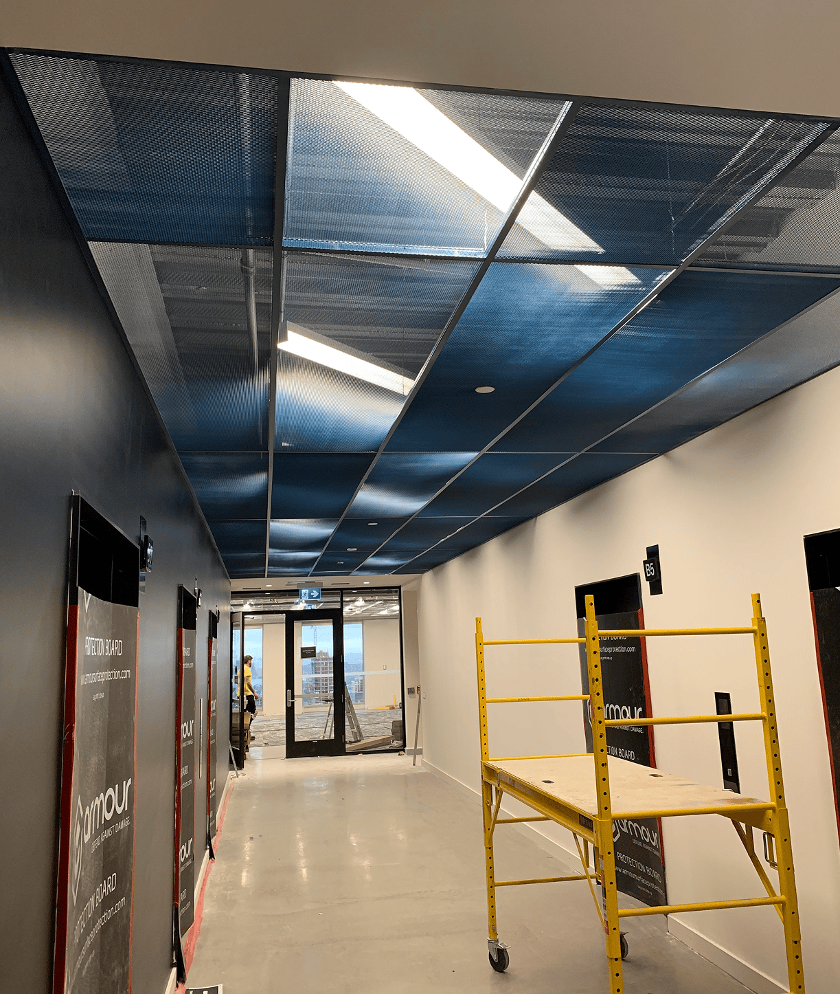 Hallway under renovation with yellow scaffolding