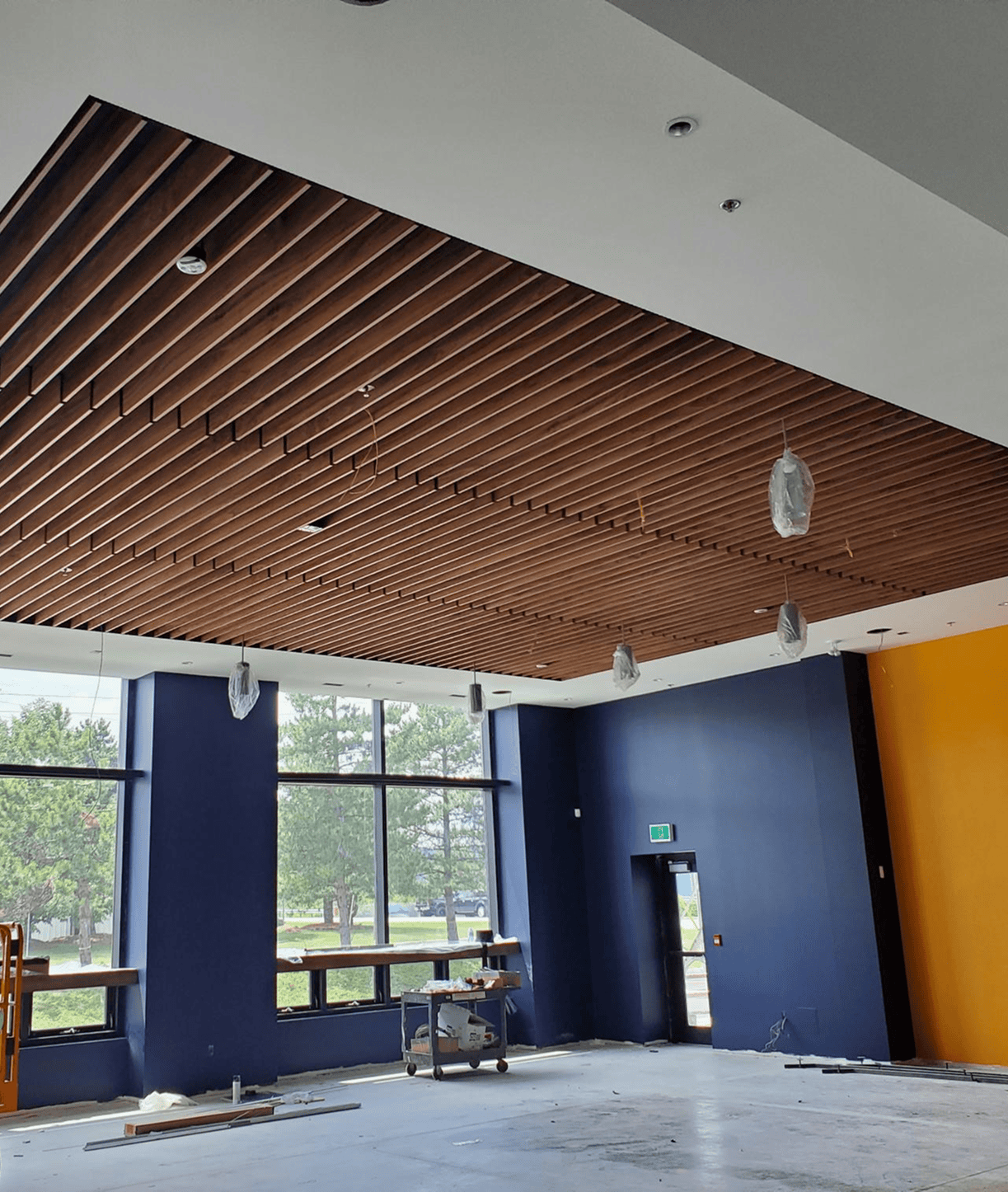 Room under renovation with slatted wooden ceiling