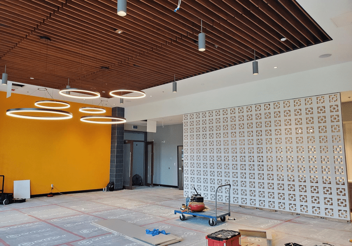 Modern interior under construction with circular lights.
